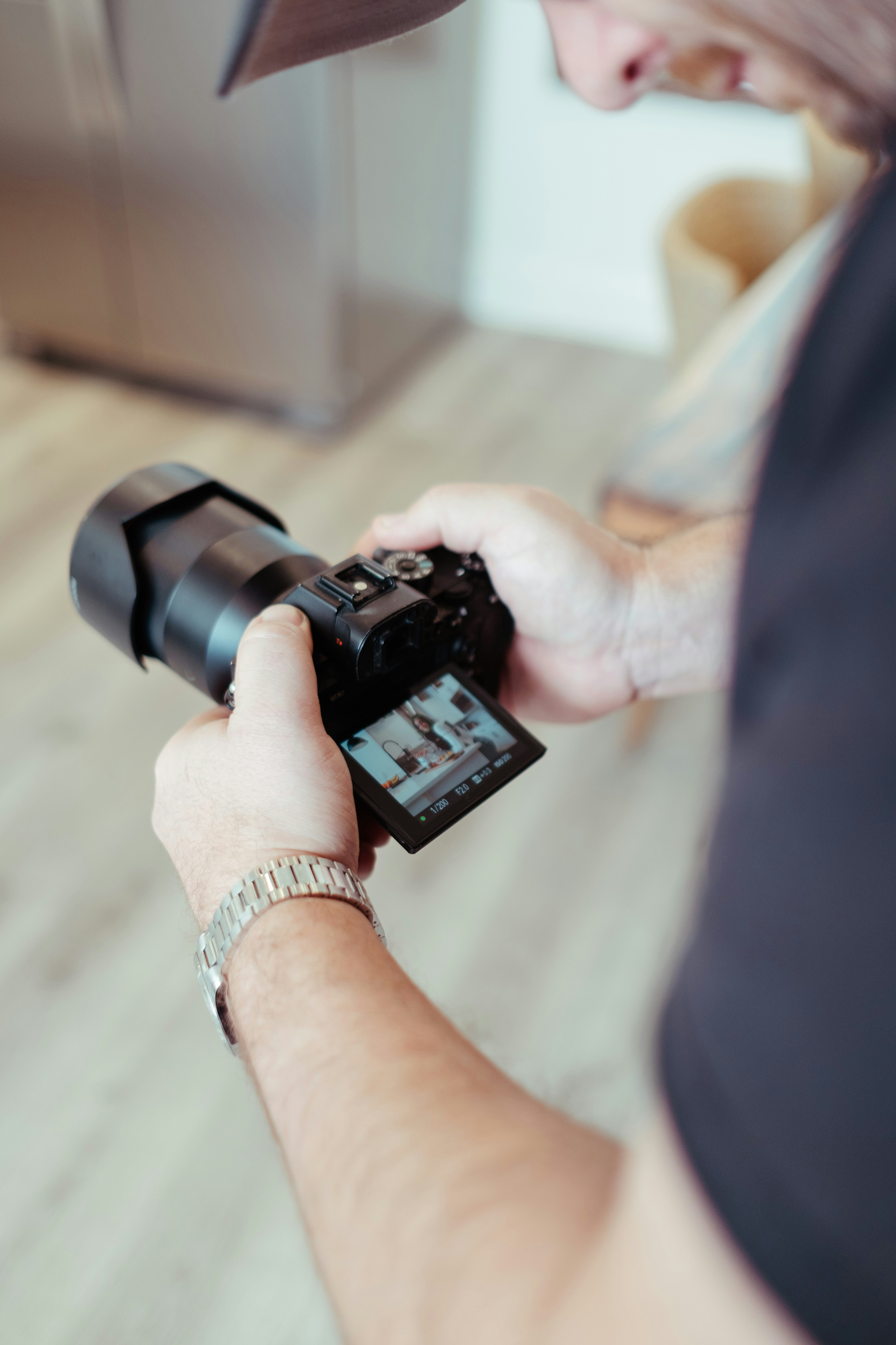 a man holding a camera in his hand