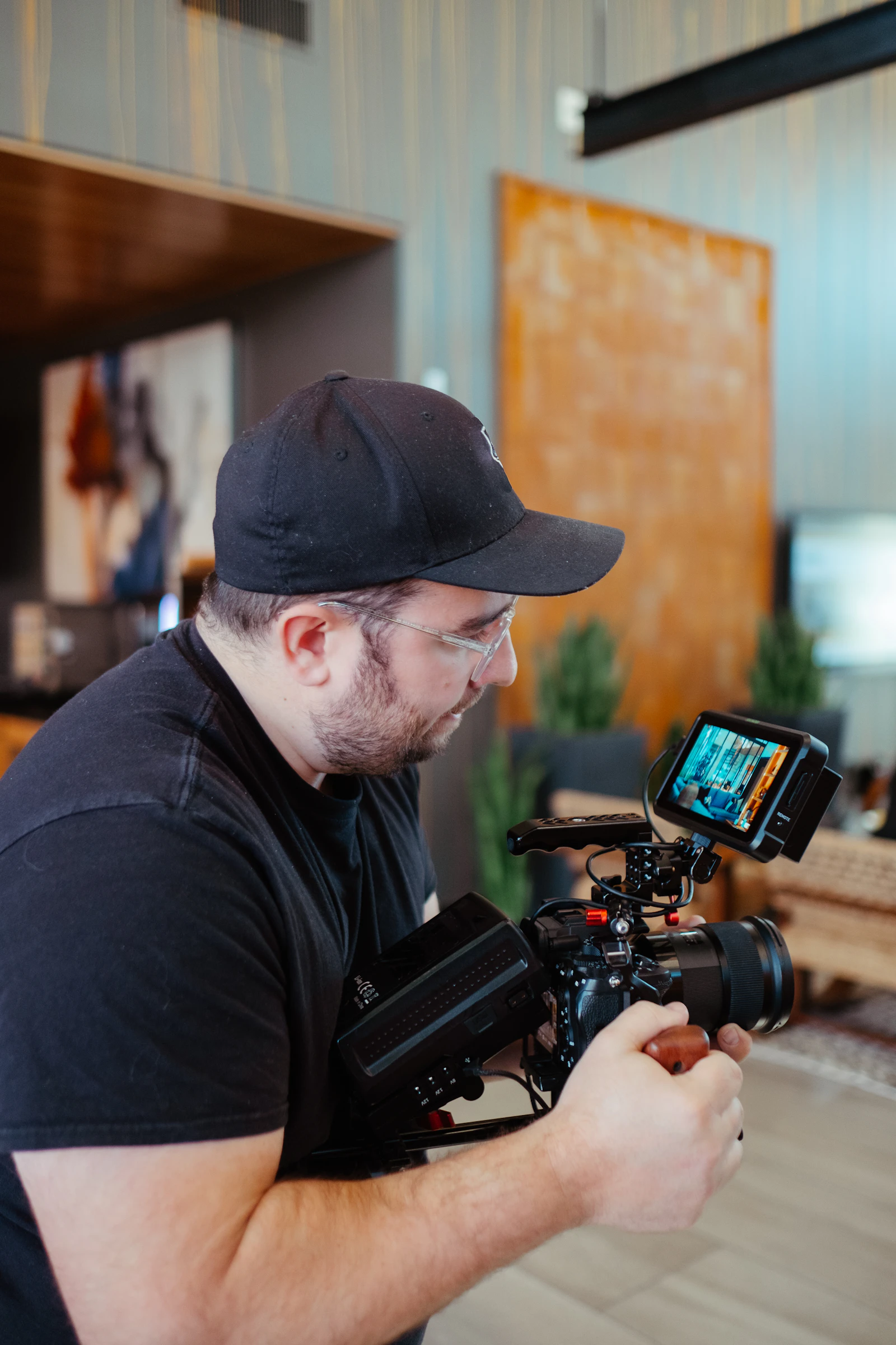 A filmmaker recording a scene with a professional video camera