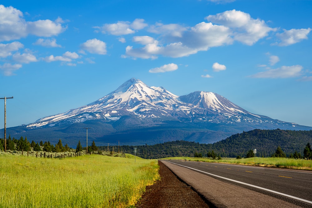 a road with a mountain in the background