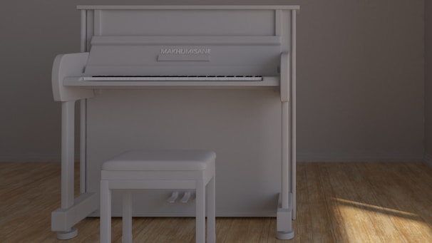 A white upright piano is positioned against a plain gray wall. A matching white bench is placed in front of the piano on a wooden floor. The lighting suggests natural sunlight coming from the right side, casting soft shadows on the floor.
