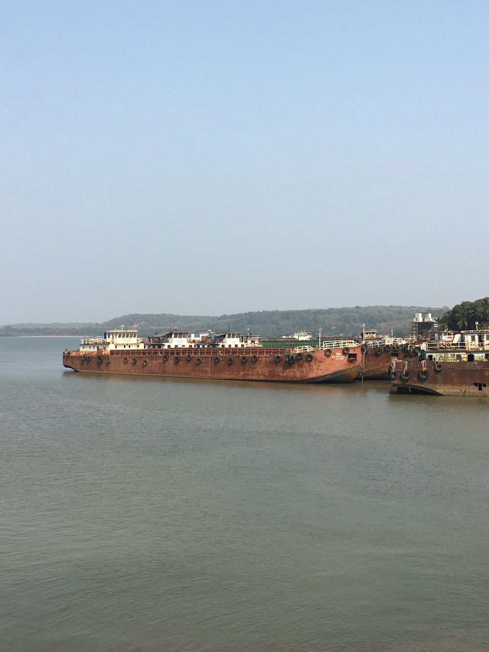 a large cargo ship in the middle of a body of water