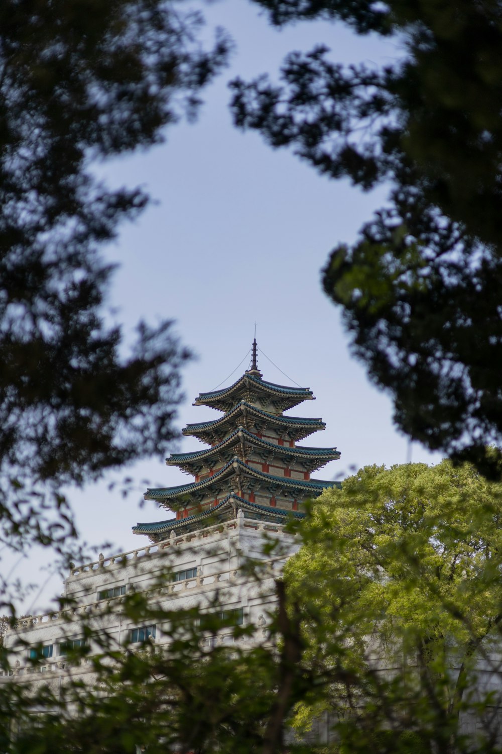 a tall building with a pagoda on top of it