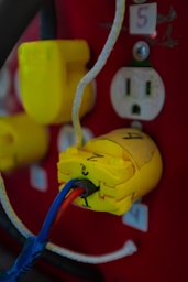 a close up of a yellow and blue electrical wire
