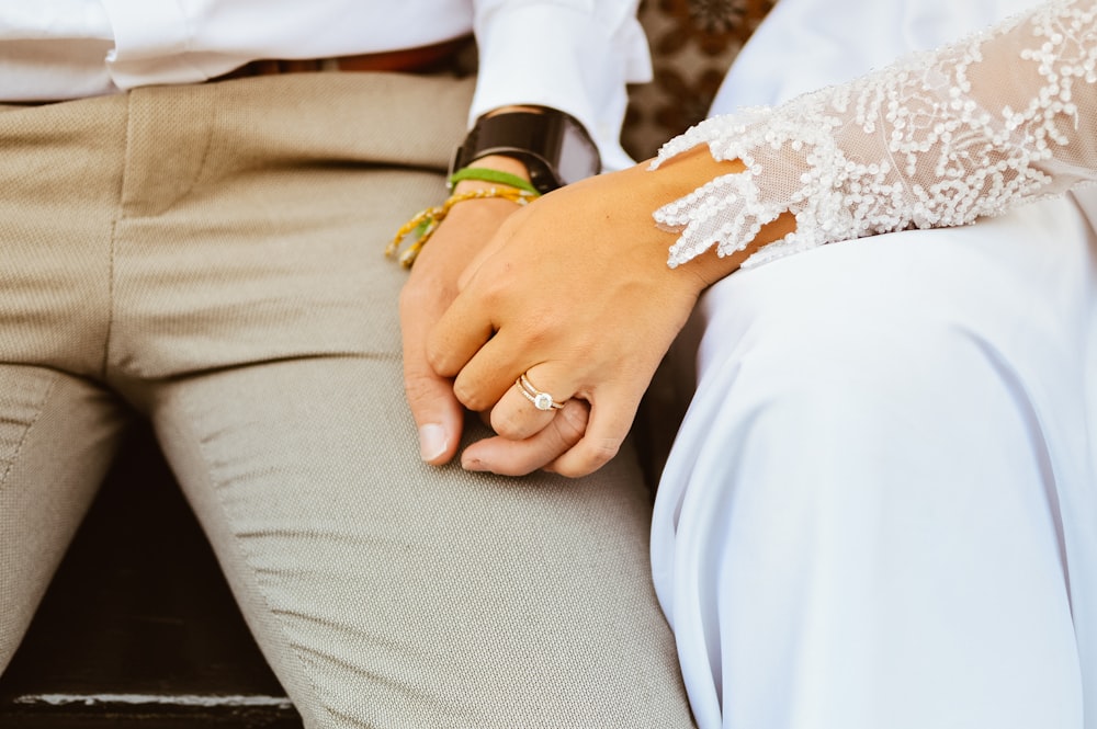 a close up of a person wearing a wedding ring