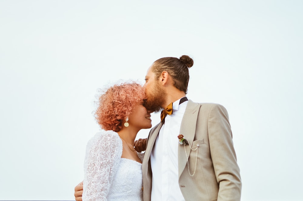 a man and a woman standing next to each other