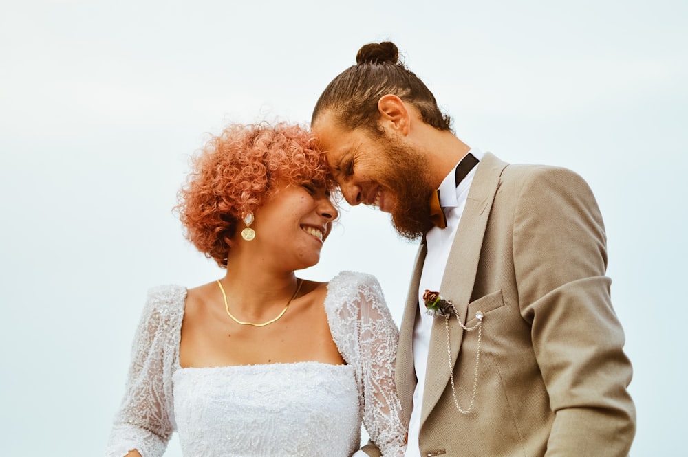 a man and a woman standing next to each other