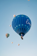 A group of enthusiastic students launching a research balloon into the clear stratospheric sky.