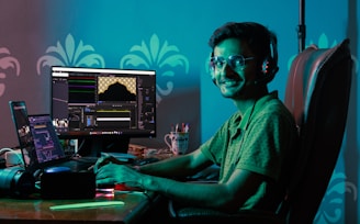 Remote employee working from home with multiple devices and headset.