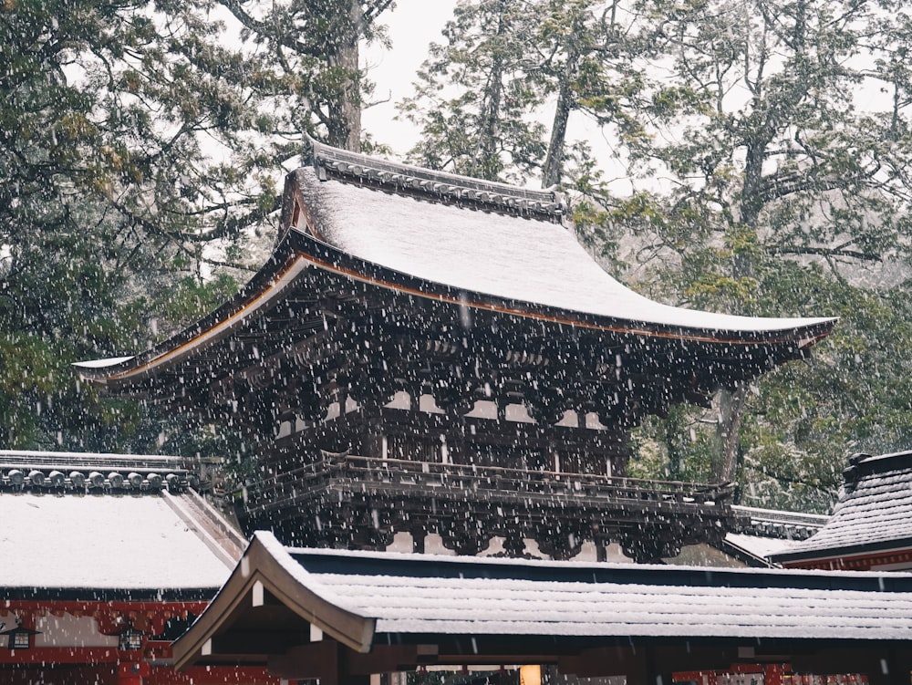 a tall building with a roof covered in snow