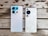 Two smartphones are placed side by side on a wooden surface. The phone on the left is a model from Infinix with a silver back and multiple camera lenses, one of which features a blue and pink-hued casing. The phone on the right is a model from Huawei, featuring a white back with a textured pattern and a prominent black camera module.