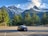 A clean and spacious rental car parked in a scenic location.