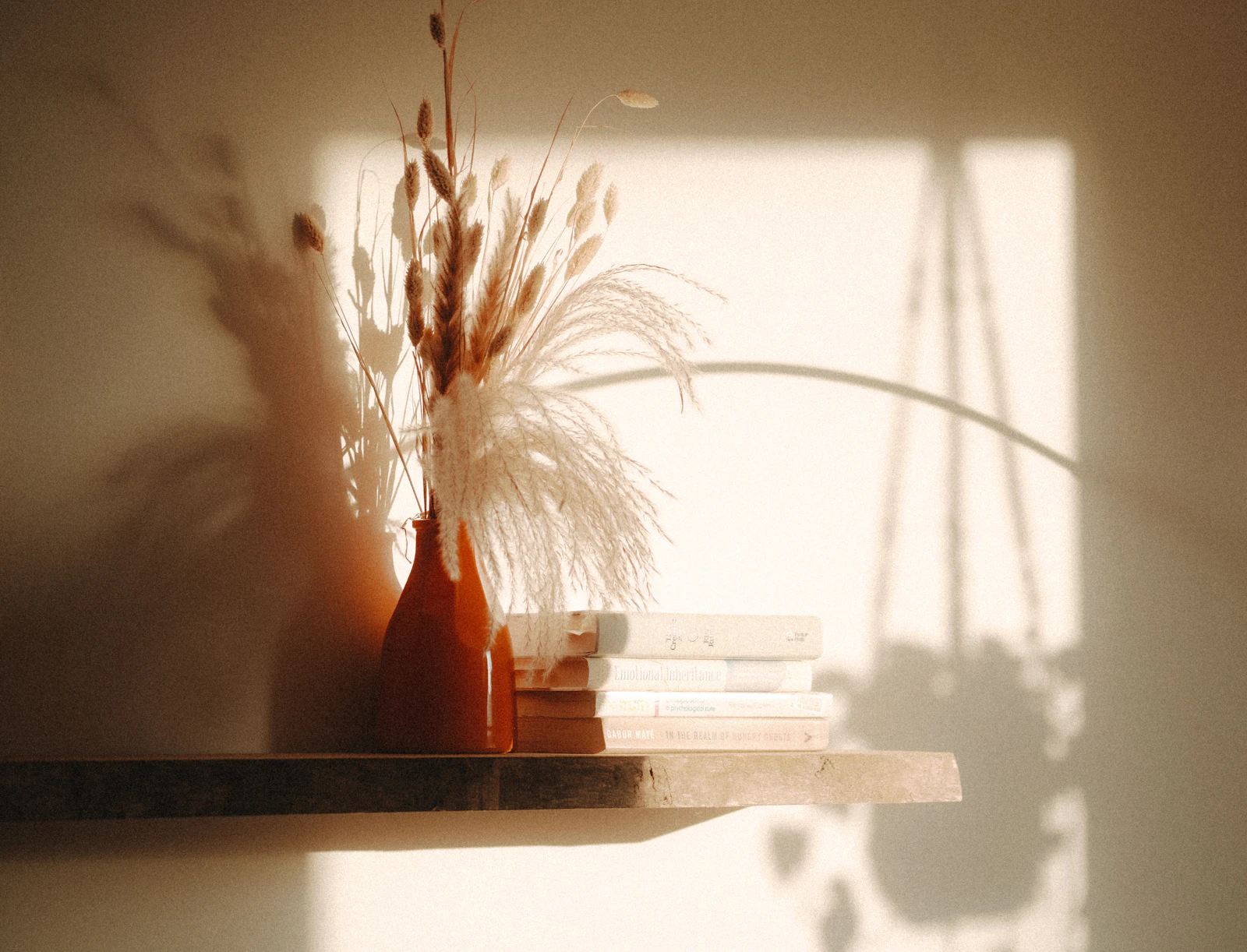 A couple of vases sitting on top of a shelf