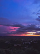 Sunset colors painting the hills above a peaceful Andalusian village