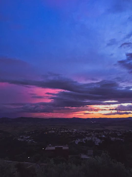 Sunset colors painting the hills above a peaceful Andalusian village