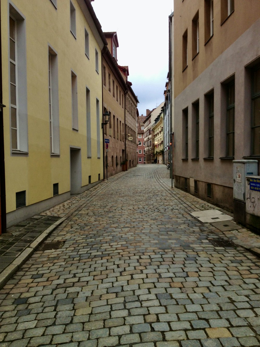 a cobblestone street in a european city