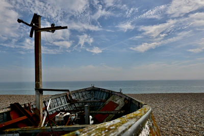 Vintage fishing boat gently resting near a quiet Adriatic shore.
