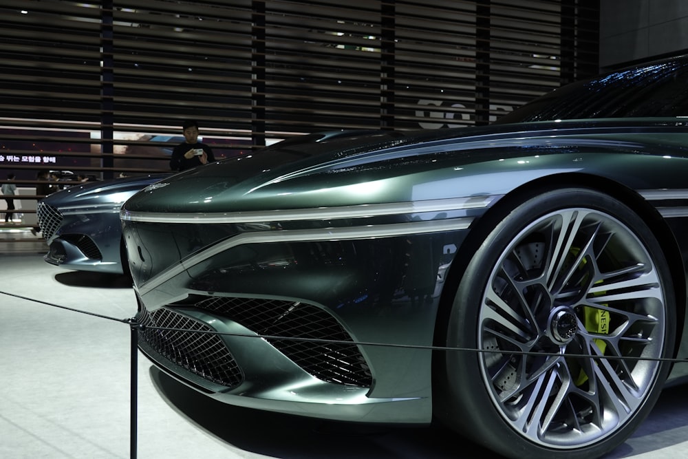 a close up of a car on display at a car show