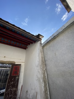 Exterior shot of a commercial building with fresh paint and repaired facade.