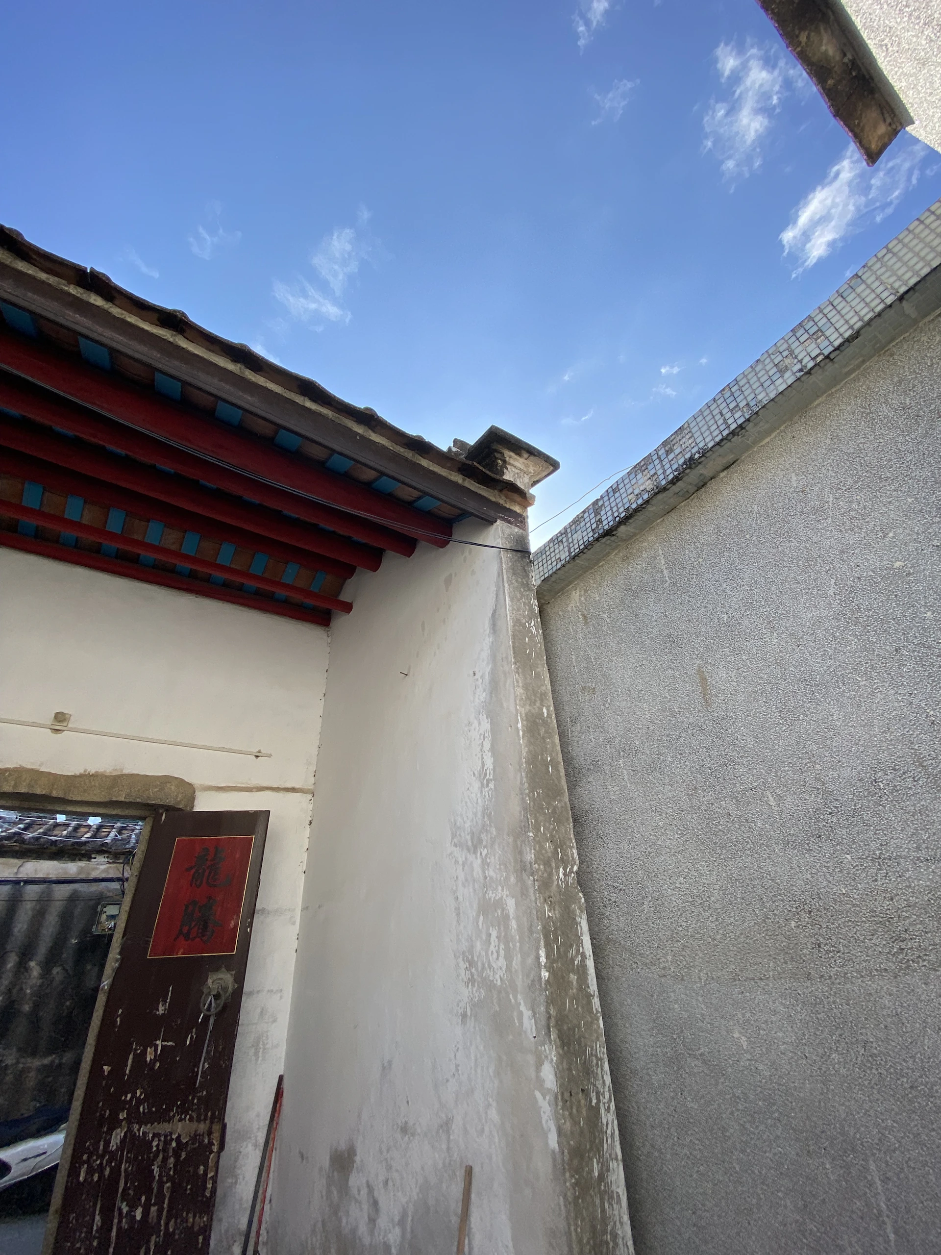 woman wearing yellow long-sleeved dress under white clouds and blue sky during daytime