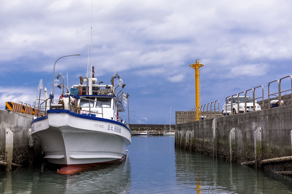 a boat is docked at a dock in the water