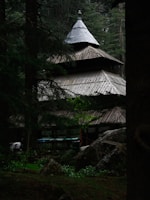 A serene wooden structure surrounded by nature.