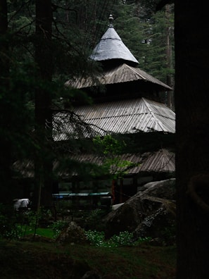 A serene wooden structure surrounded by nature.