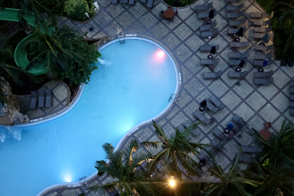 an overhead view of a swimming pool at night