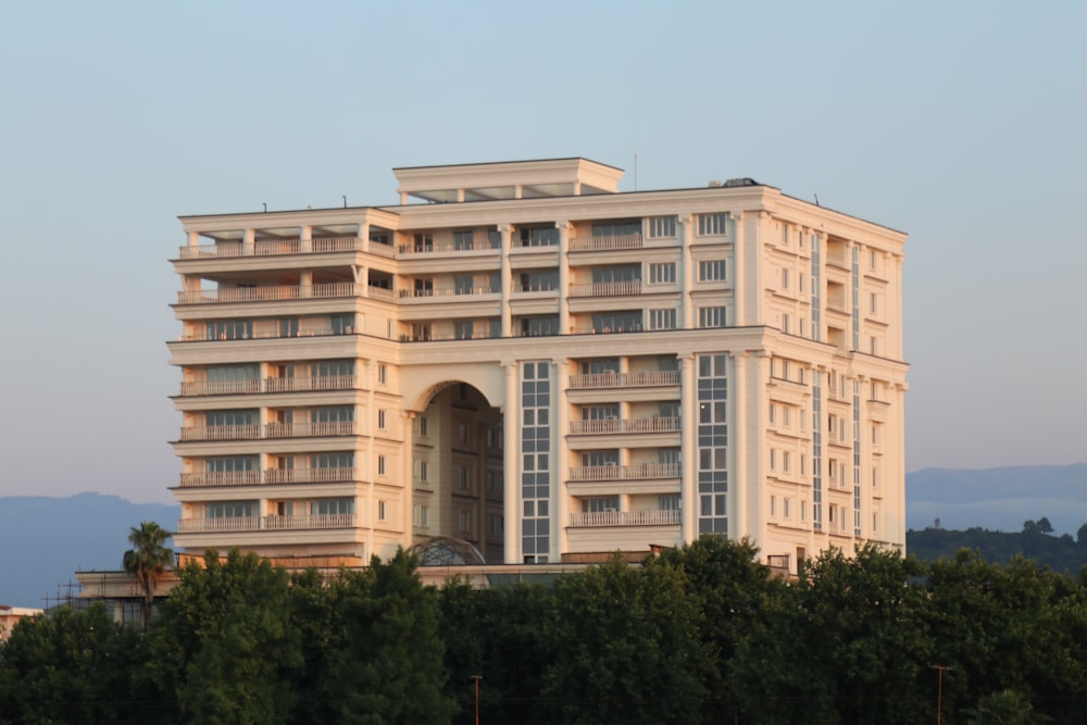 a large white building with balconies on top of it