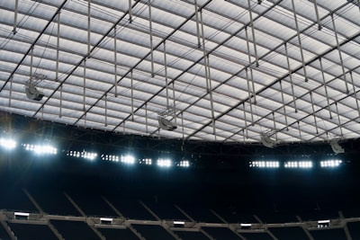 A panoramic view of a sports arena under bright lights.