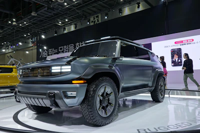 A family SUV with roof racks displayed on the showroom floor.