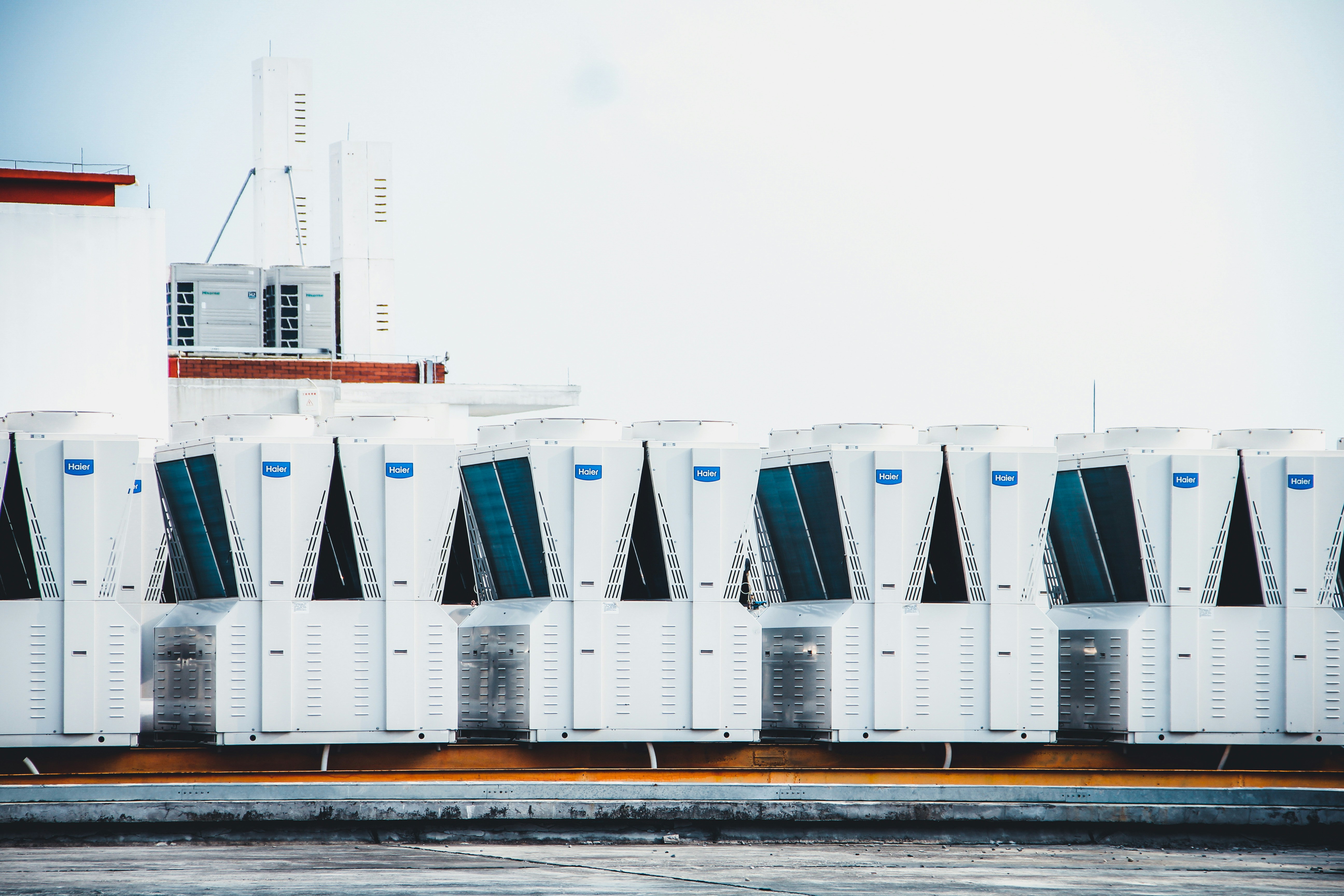 Multiple Tesla Supercharger stalls lined up at a modern charging station