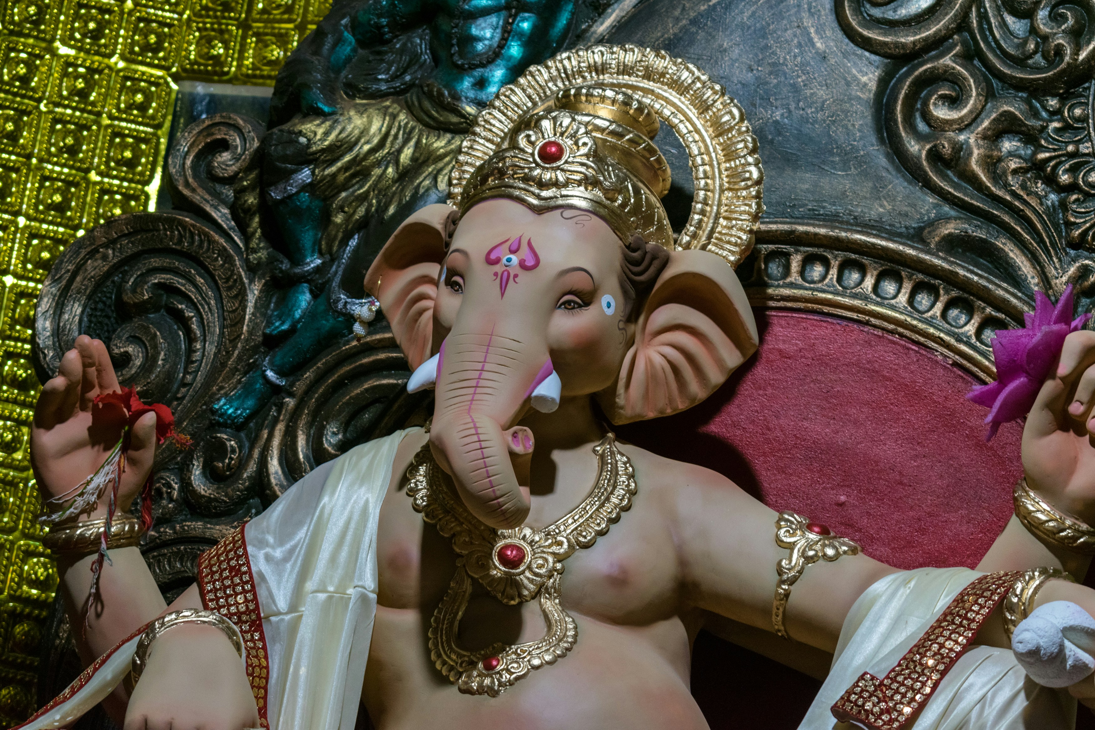 a statue of an elephant sitting on top of a couch