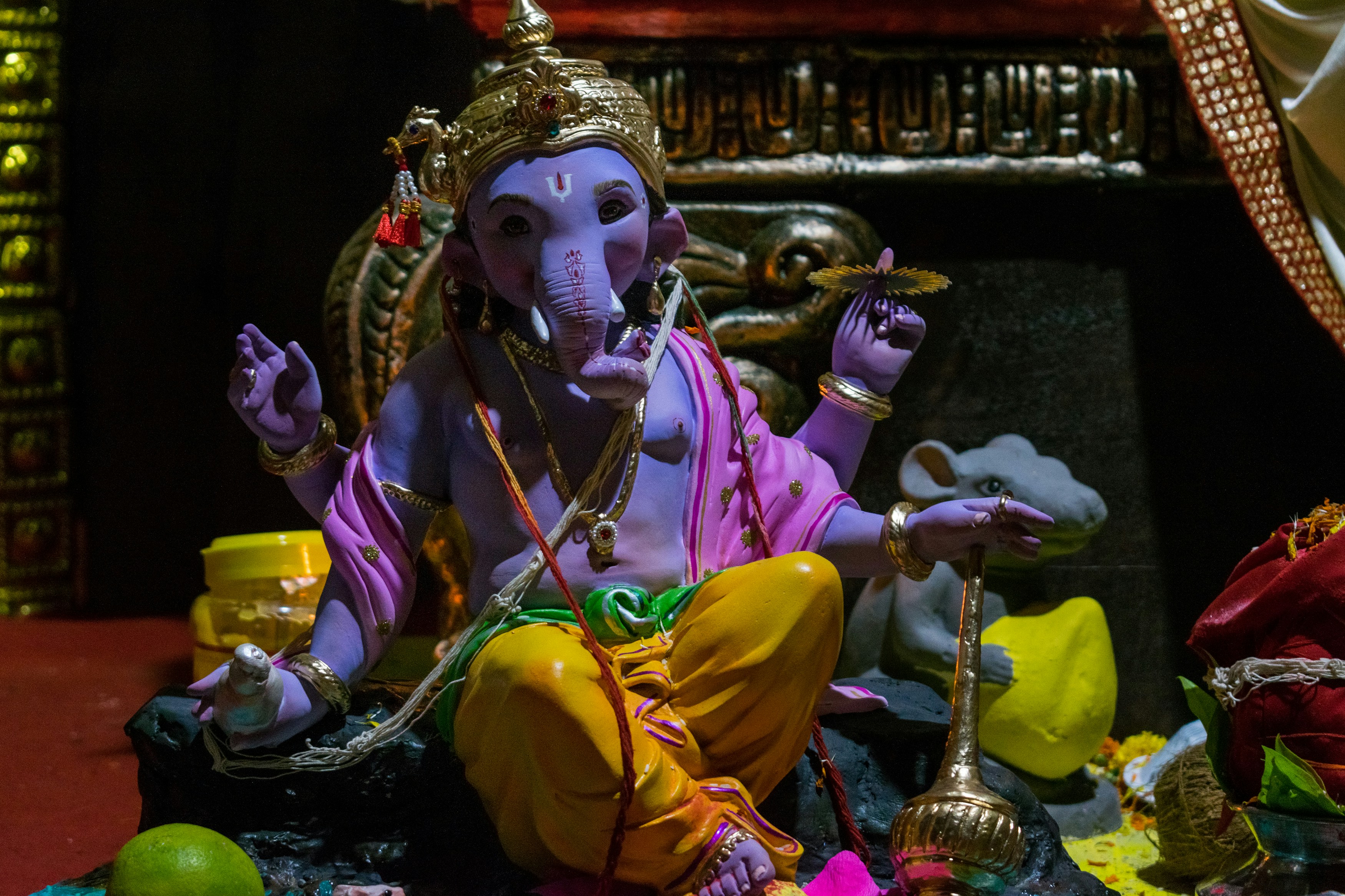 a statue of an elephant sitting on top of a table