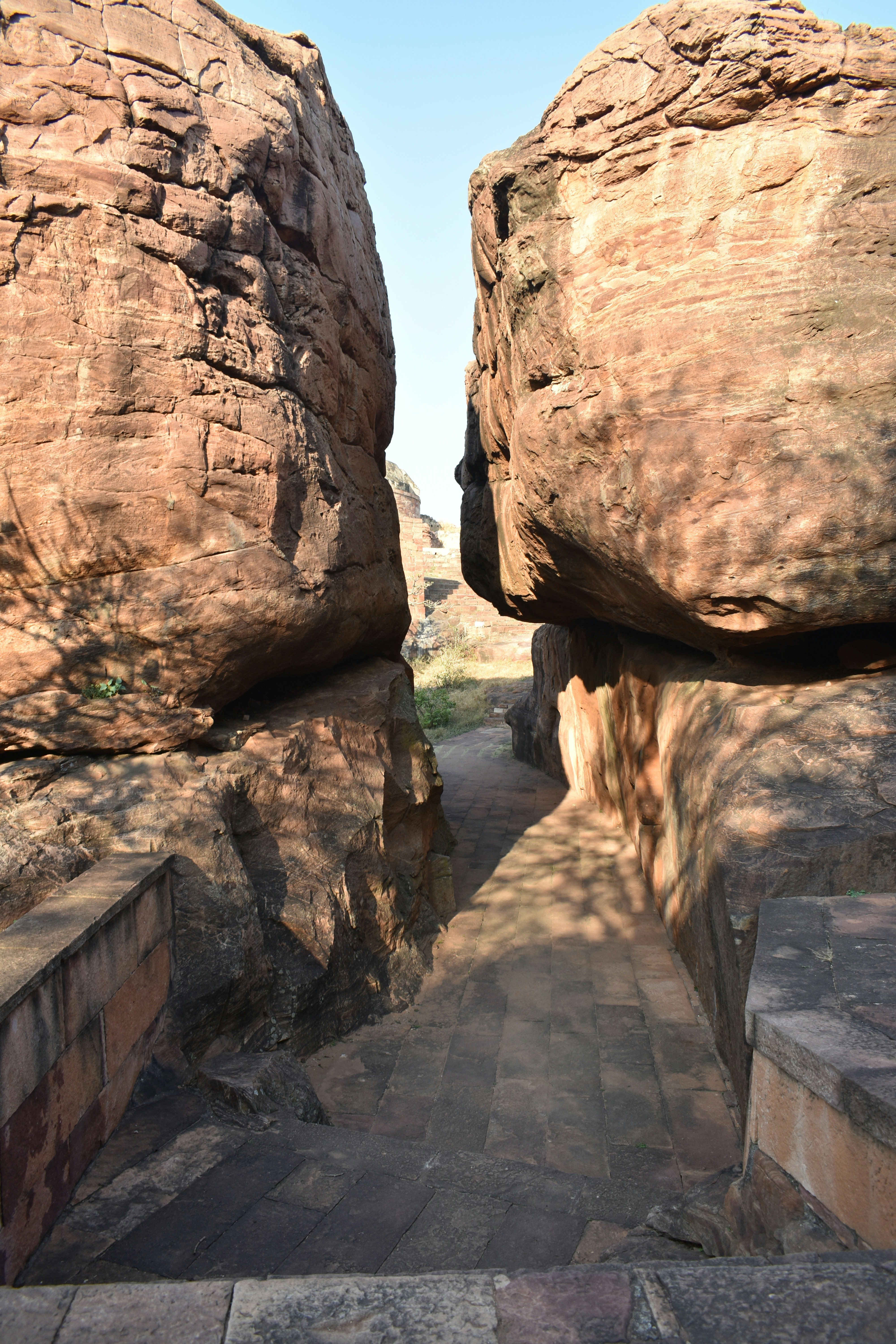 A stone walkway between two large rocks photo – Free City Image on Unsplash