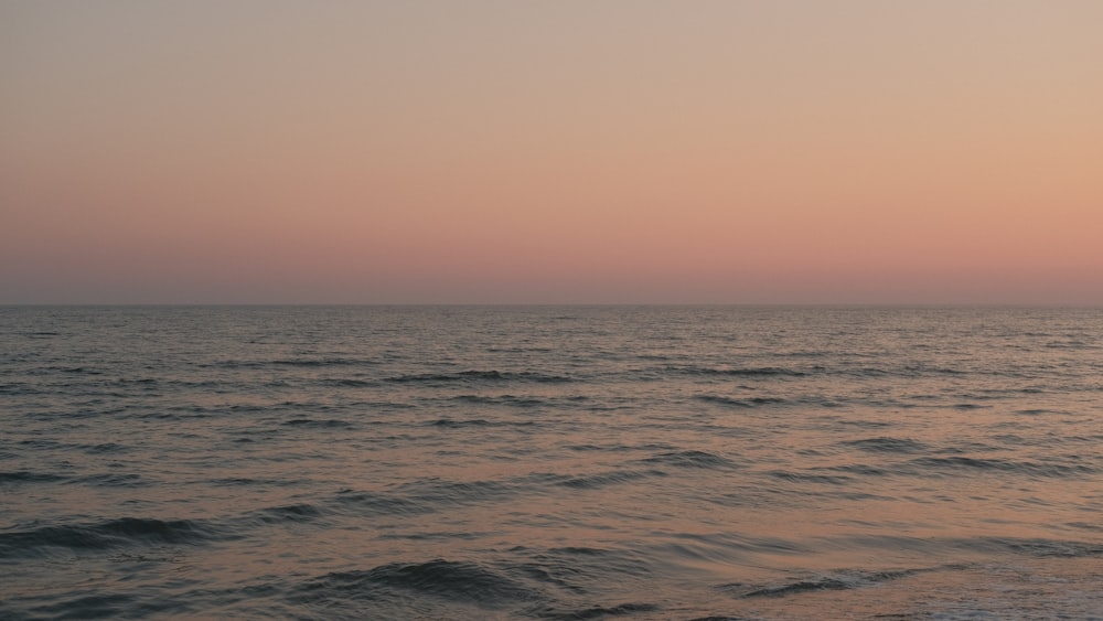 a body of water with waves coming in to shore