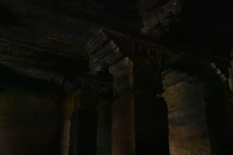 An ancient Masonic temple interior with symbolic pillars and soft lighting.