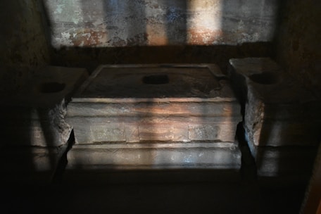 A mystical altar with candles, crystals, and ancient symbols glowing softly in a dark room.