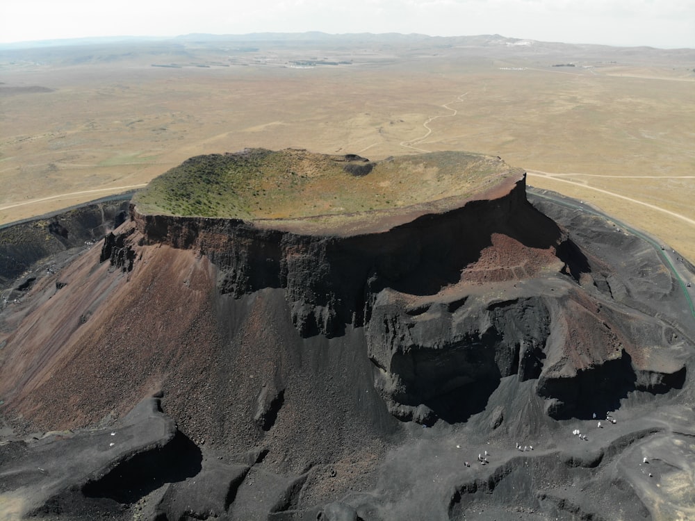an aerial view of a crater in the middle of nowhere