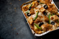 Close-up of a nutritious frozen dish being heated in a microwave.
