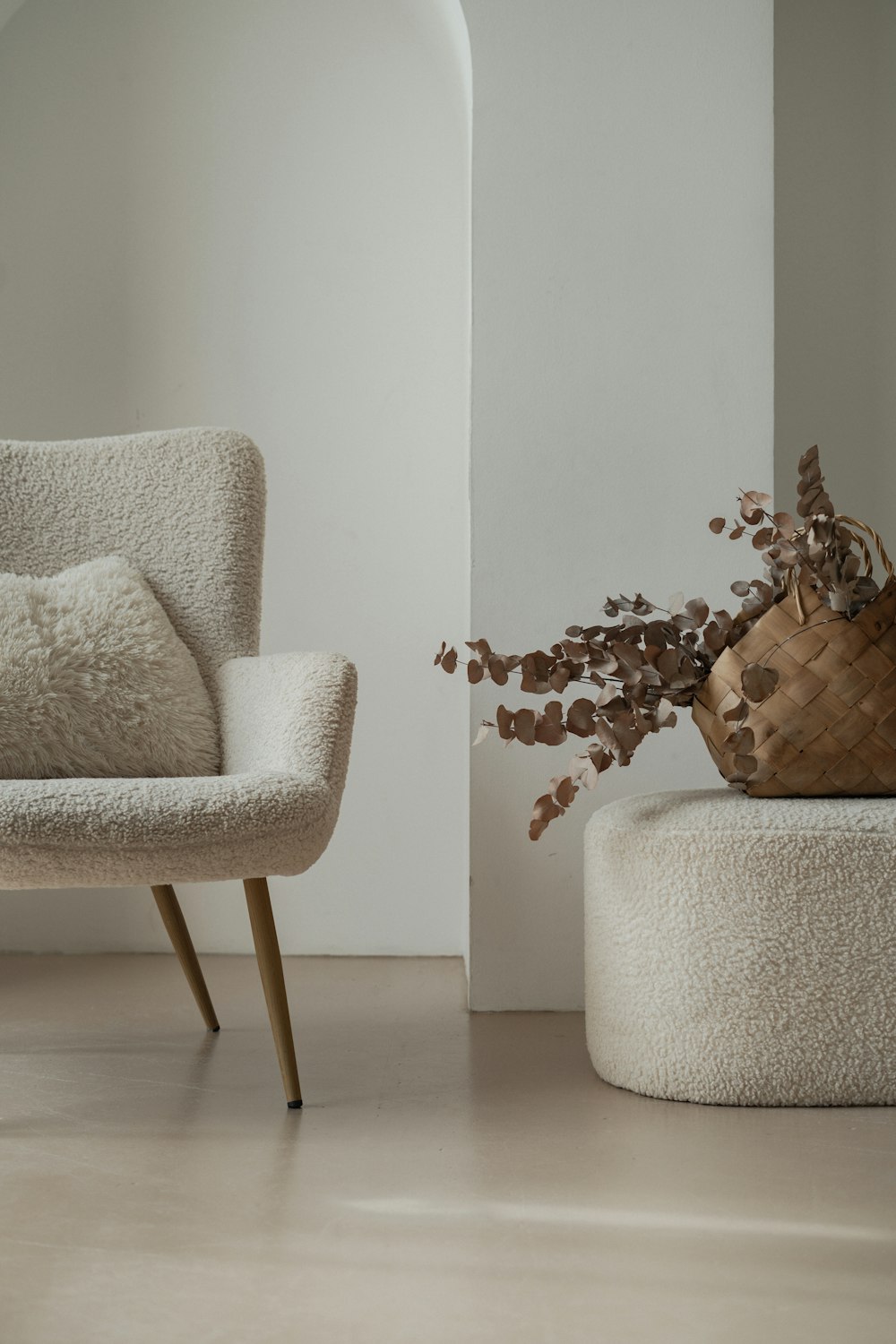 a chair and a foot stool in a room