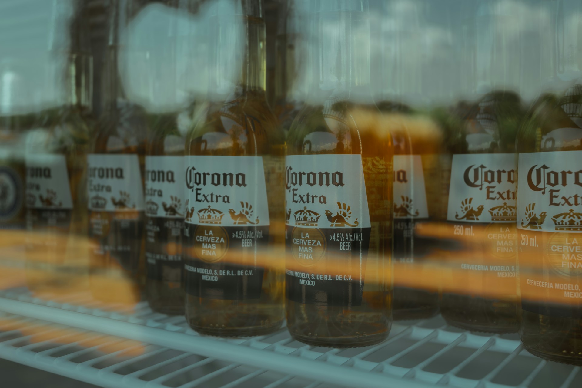An assortment of Grupo Modelo's beer brands arranged artfully with branded packaging and festive decorations.