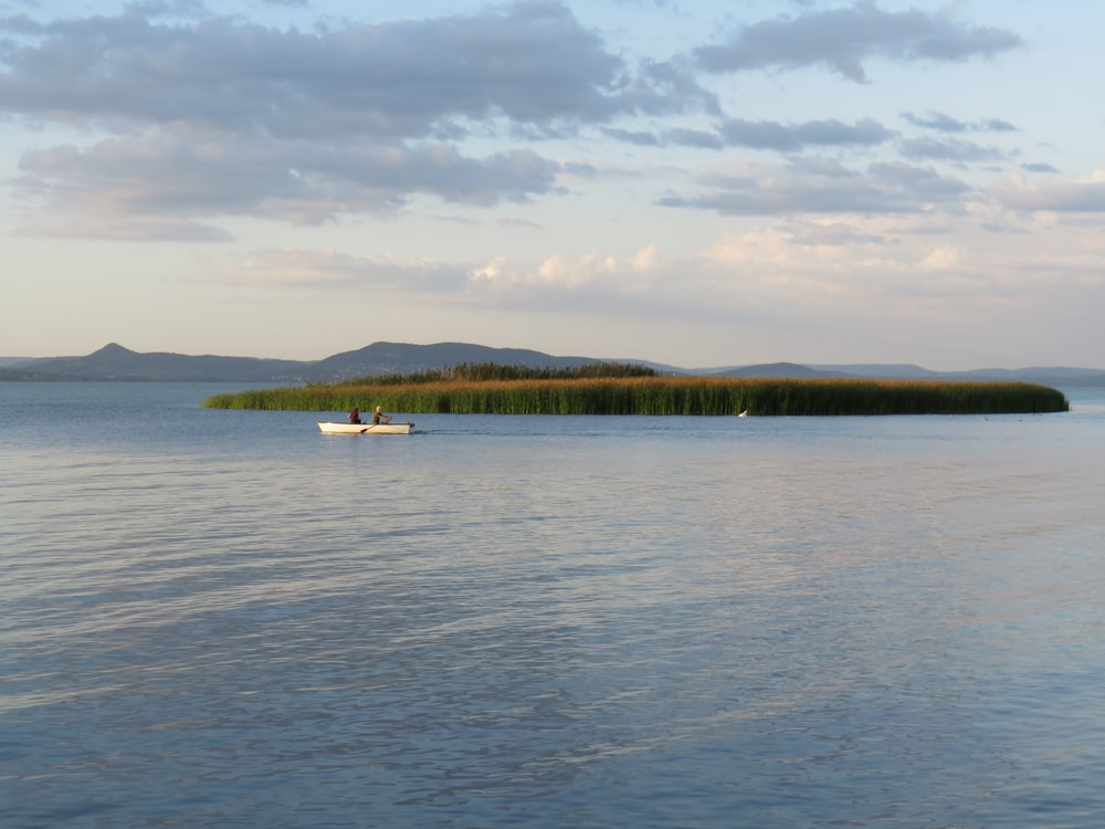 a boat floating on top of a large body of water