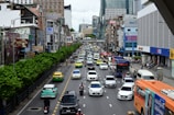 A busy street with various vehicles parked legally.