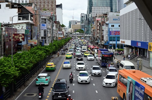 A busy street with various vehicles parked legally.
