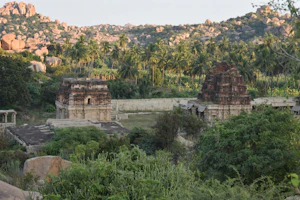 Ancient temples nestled among dense forested hills in Uttarakhand.