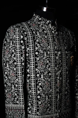 a black and white jacket on a mannequin