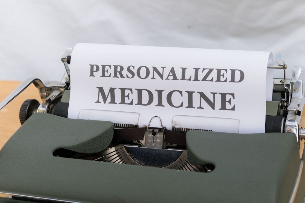 a typewriter with a piece of paper that reads personalized medicine