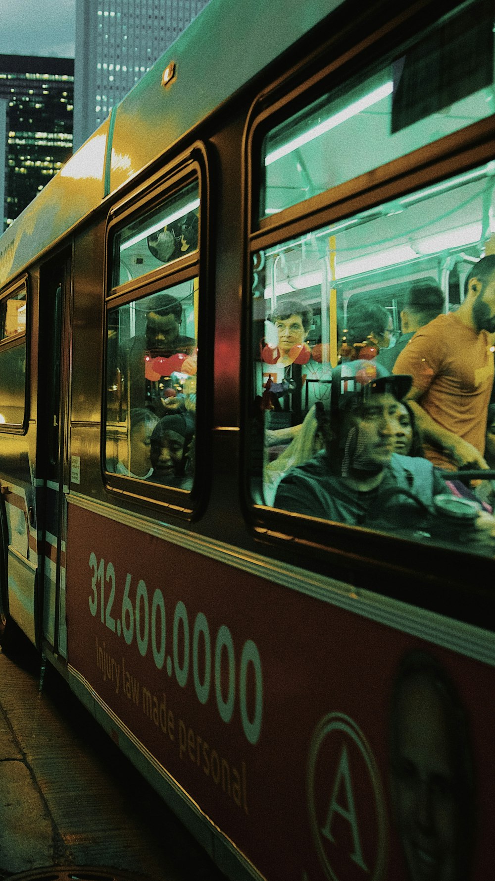 a city bus with a lot of people on it