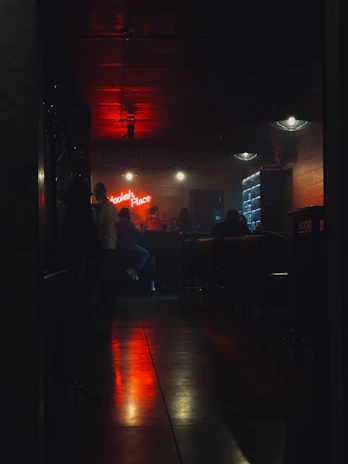 A cozy lounge scene with friends sharing a hookah, soft golden lighting highlighting elegant details.