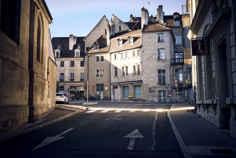 an empty street in a city with buildings on both sides